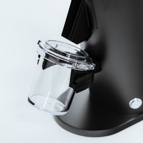 DF54 Coffee Grinder with clear grounds container attached, showcasing its design and functionality.