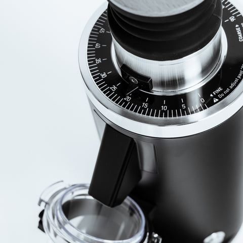 DF54 Coffee Grinder top view showcasing 54mm flat burr and grind size adjustment for low retention grinding.