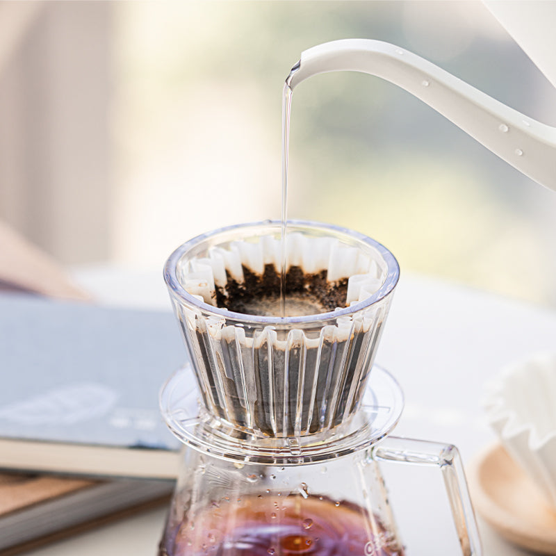 water pouring into the transparent Timemore B75 Crystal Eye Flat Bottom Dripper/Brewer