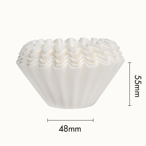Stack of white coffee filters with dimensions labeled on a white background