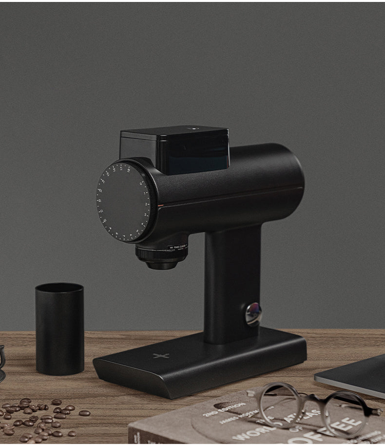 Black Timemore Sculptor 078S Electric Grinder on table with coffee beans