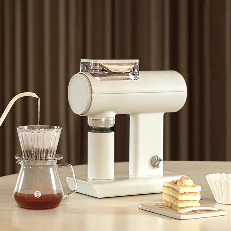image of white Timemore Sculptor 078S Electric Grinder alongside pour over setup