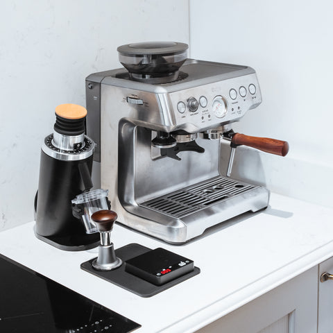 DF54 Electric Coffee Grinder and espresso machine on kitchen counter, showcasing modern coffee brewing setup.