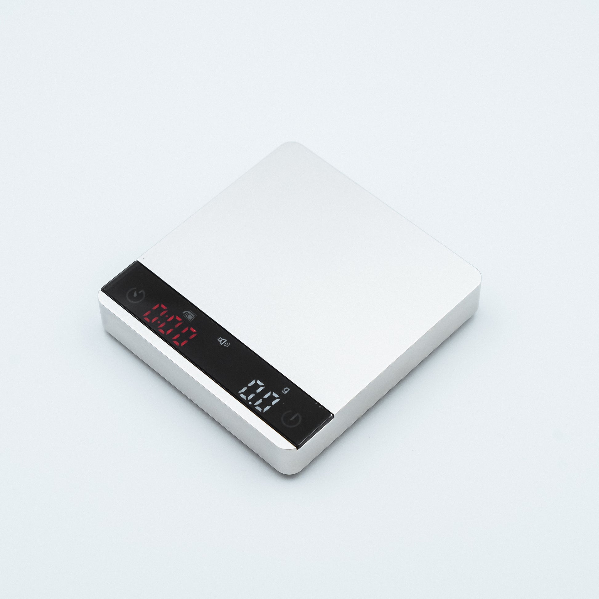white Earl Nano Metal Coffee Scales in metallic style finish, with espresso weighing scale