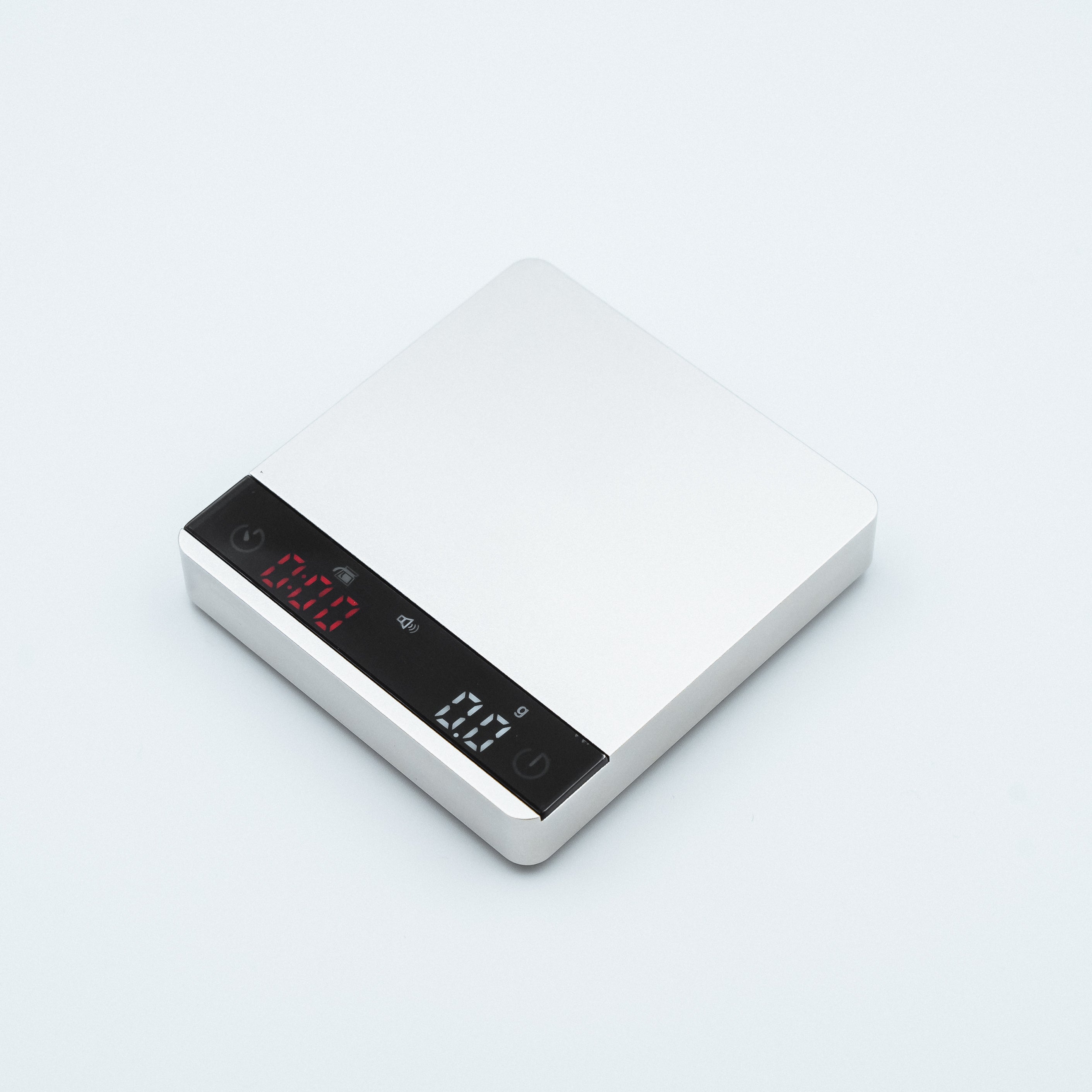 white Earl Nano Metal Coffee Scales in metallic style finish, with espresso weighing scale