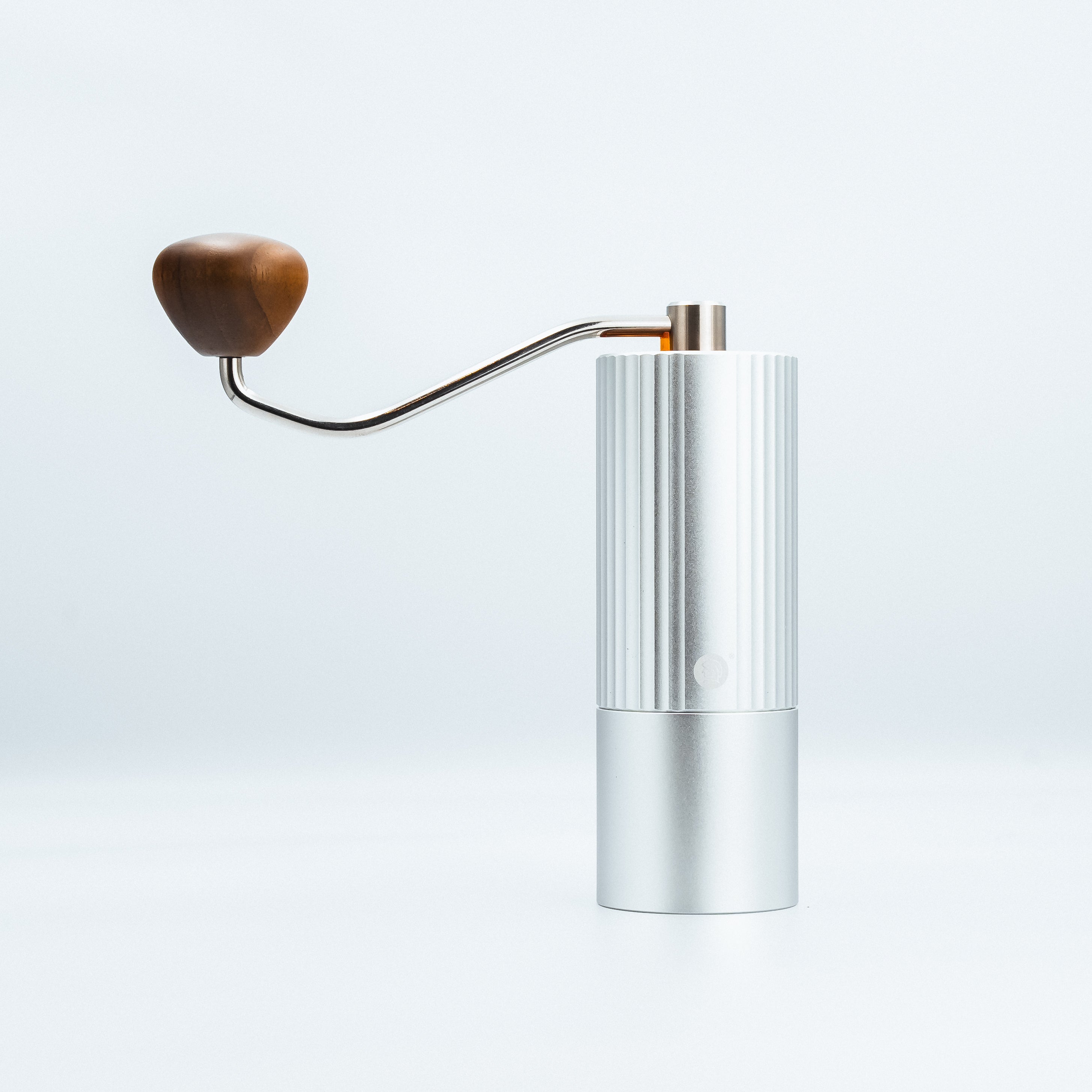 the zeroHero Z3 Pro Coffee Hand Manual Grinder in silver with ergonomic solid wood handle