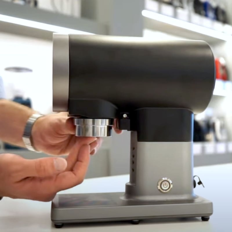 image of Eureka Disko Automatic Tamper in use showing side angle